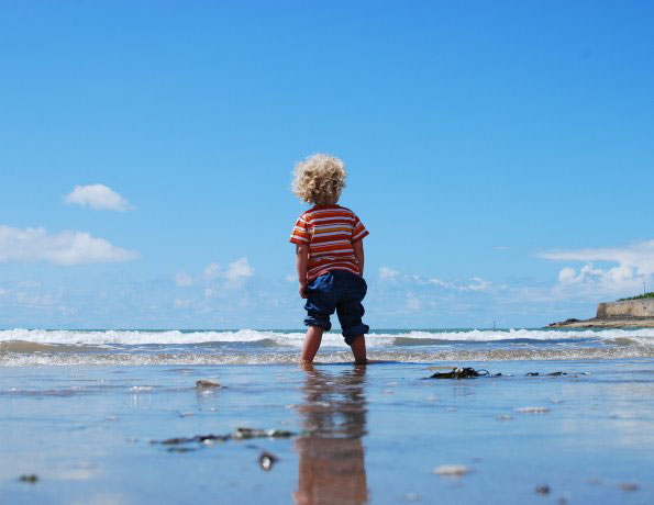 Kid standing on a beach