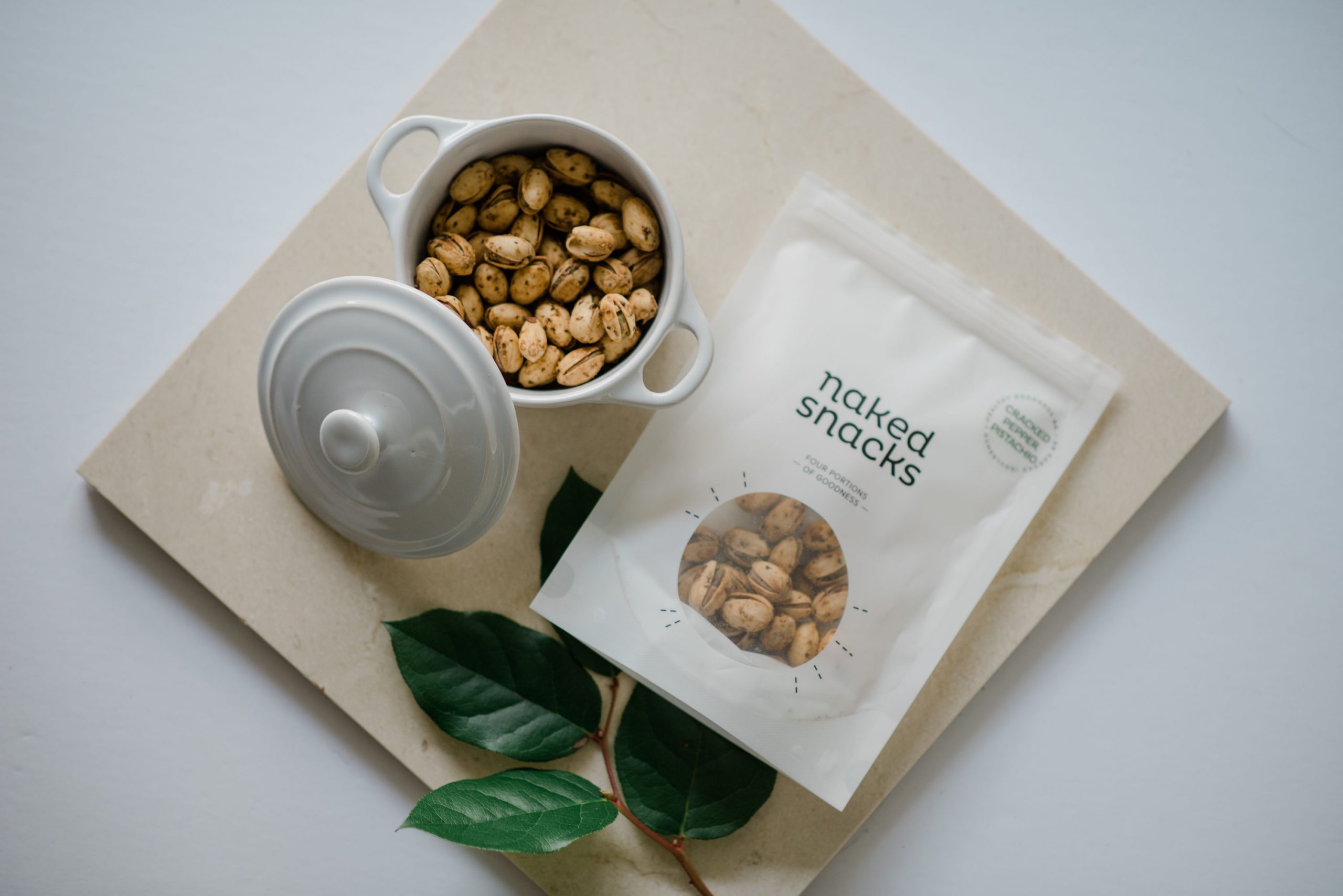 a bag of cracked pepper pistachio snacks from naked snacks